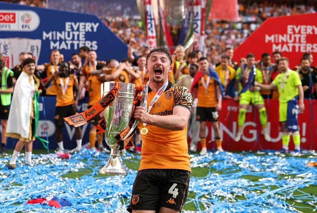 Player celebrating with trophy after winning match