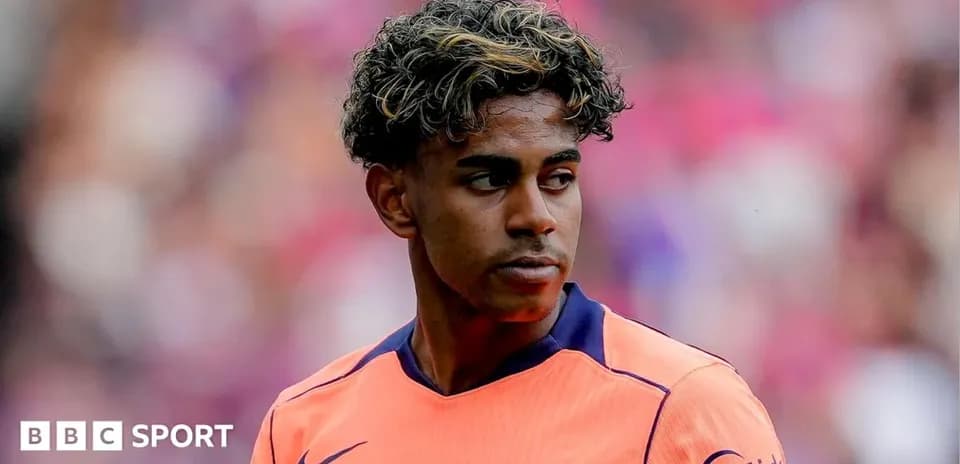 Barcelona player in orange jersey on the field