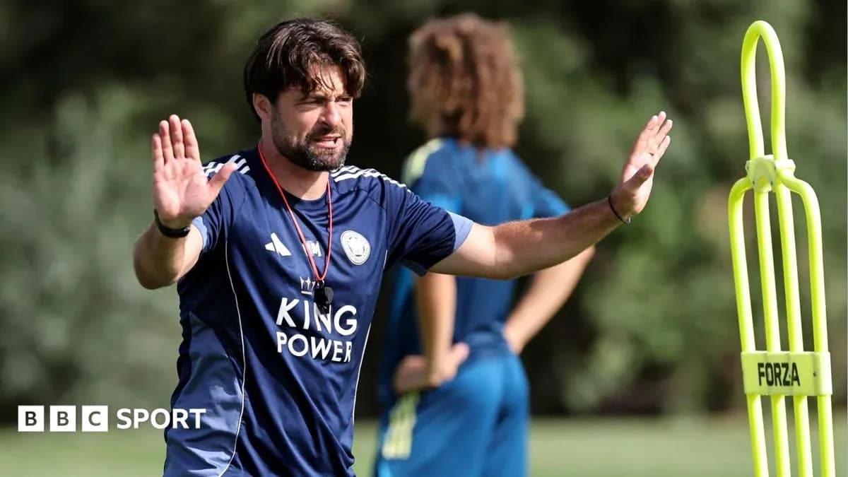 Coach directing players during training session