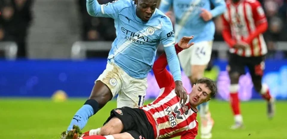 Player tackling opponent during intense football match