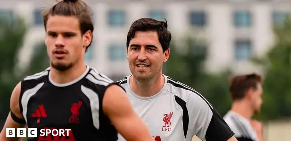 Two Liverpool players training on the pitch