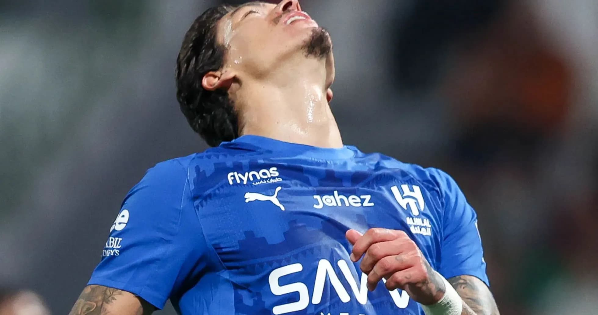 Player in blue jersey reacting during a match