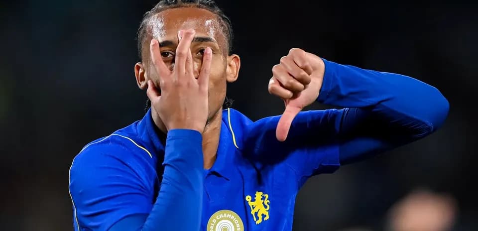 Player gesturing during match celebration in blue jersey