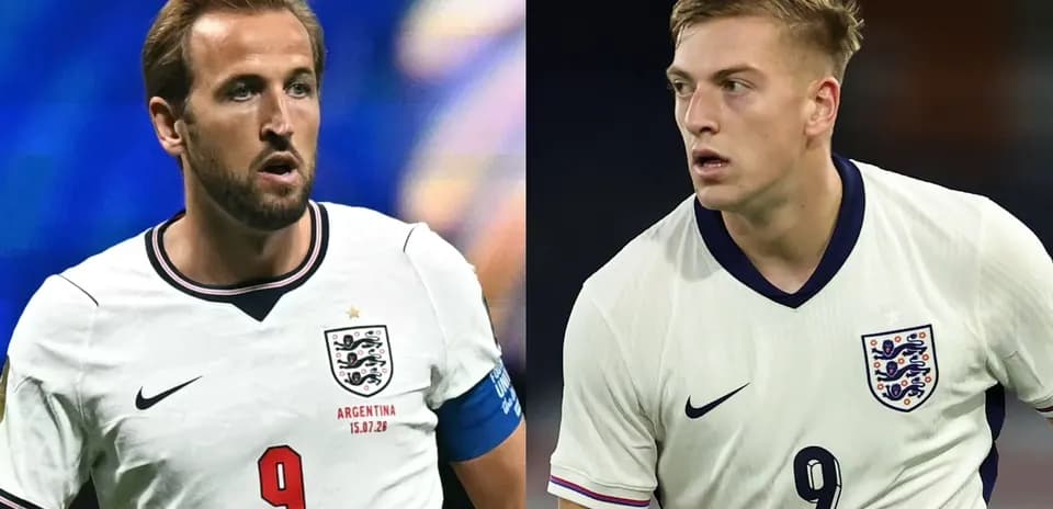 Two England players in white jerseys on the field