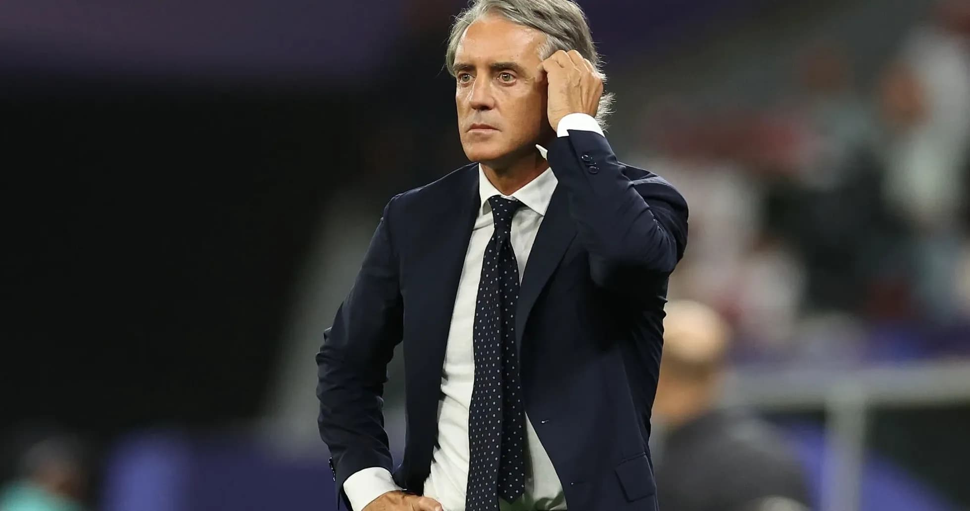 Coach on the sidelines during a match