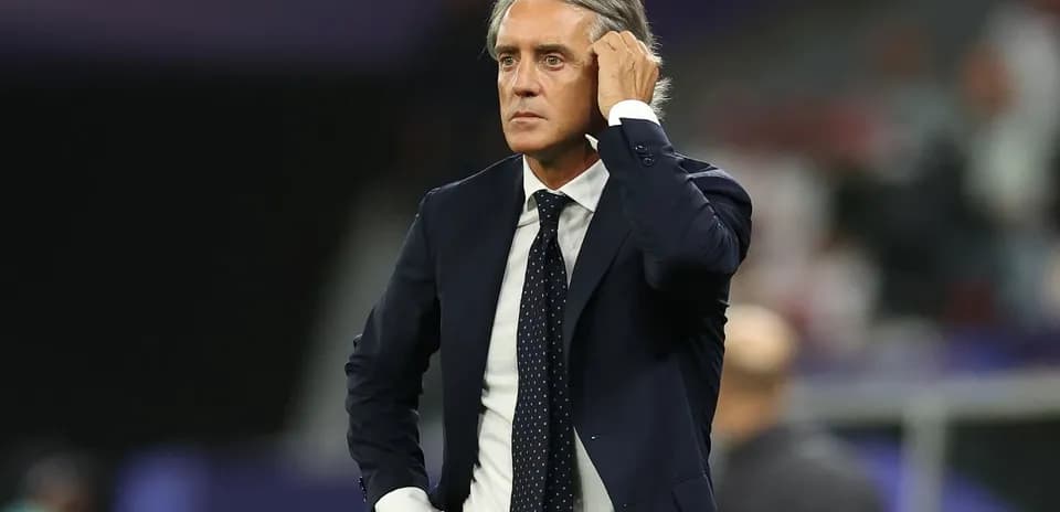 Coach on the sidelines during a match