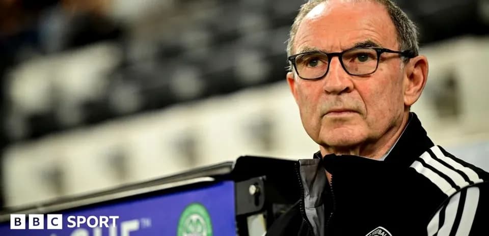 Manager seated on bench during match