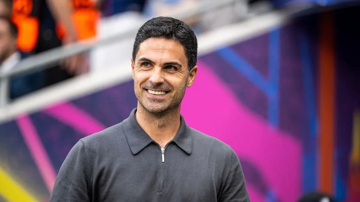 Coach smiling before match in stadium