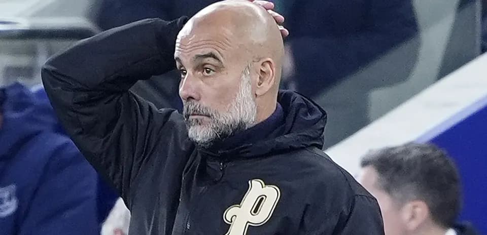 Coach observing the game with hand on head