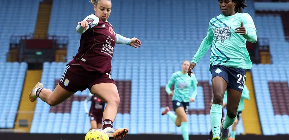 Aston Villa player shooting the ball