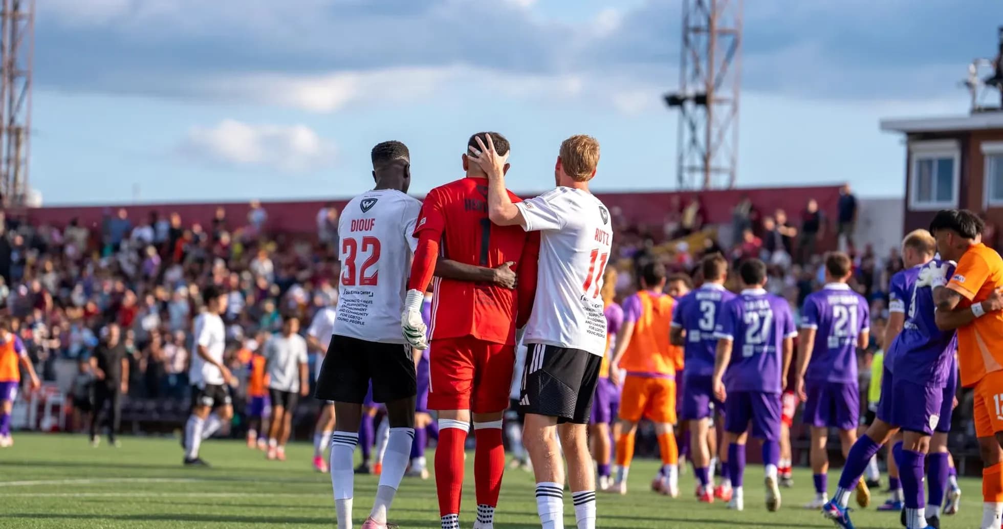 Players embracing after the match