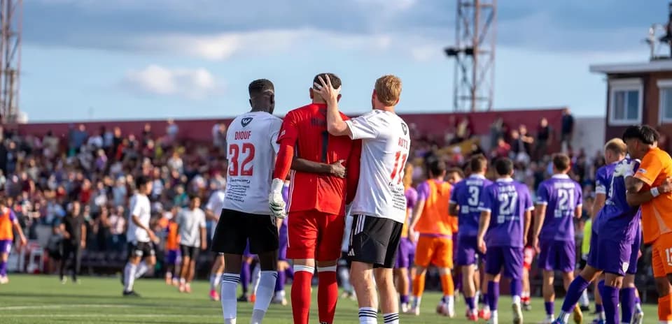 Players embracing after the match