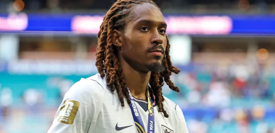 Player walking off field wearing England jersey