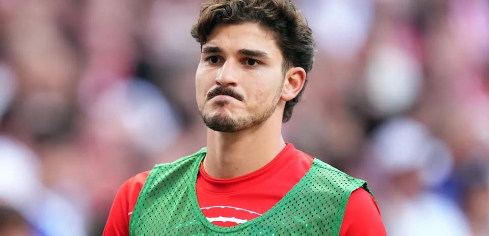 Player wearing training bib on the sidelines