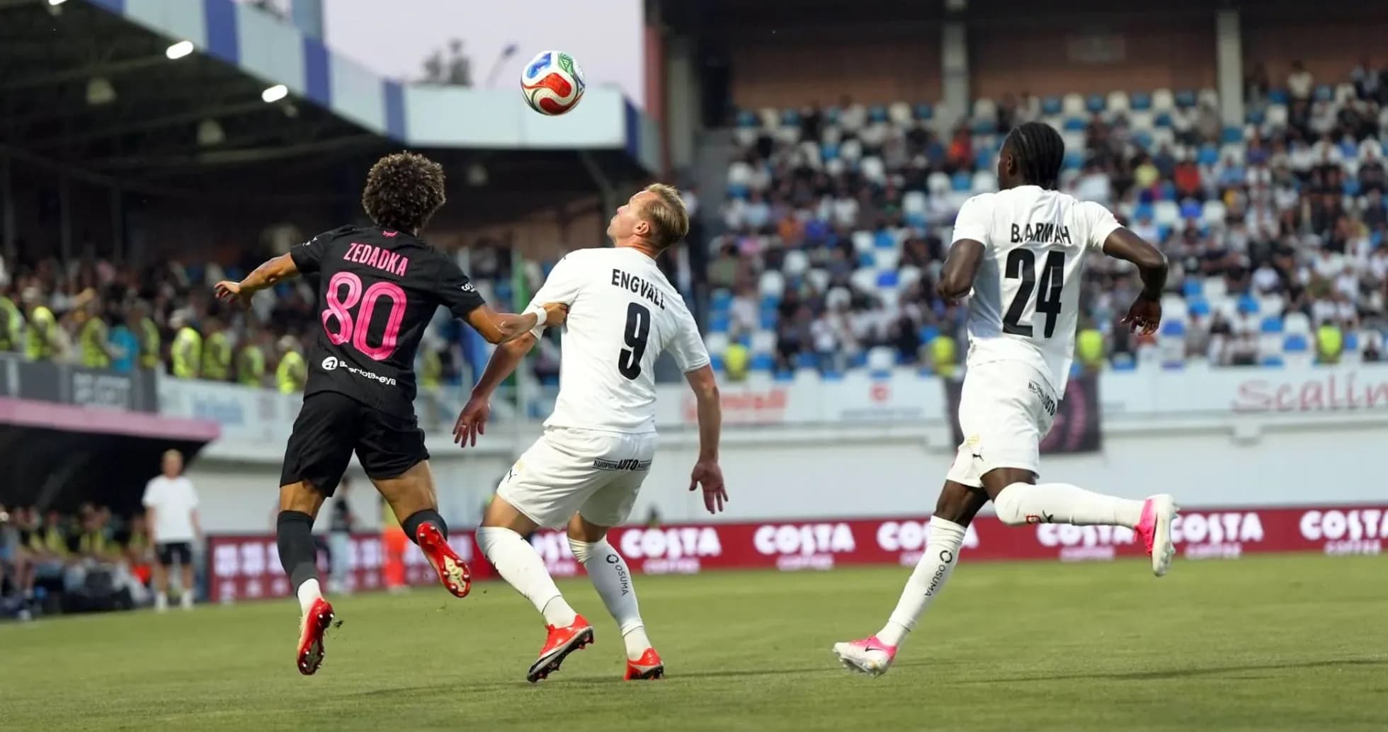 Zedadka and Engvall challenging for the ball