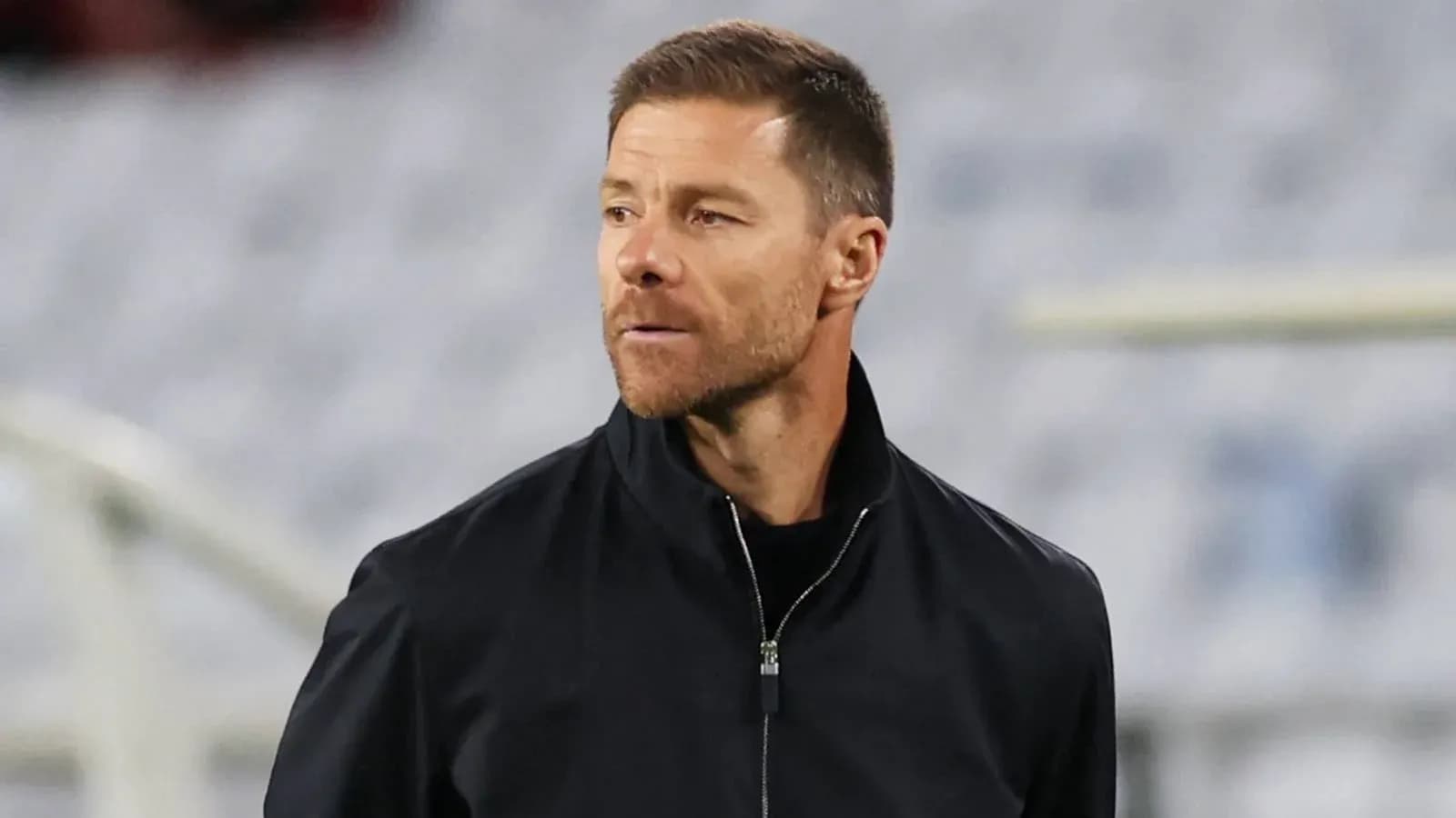 Coach observing the game from the sidelines