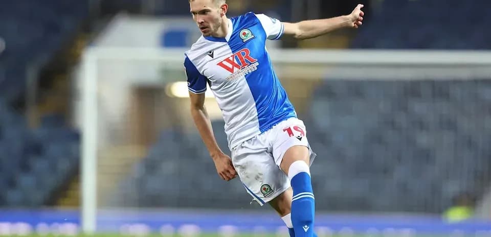 Player kicking ball during a football match