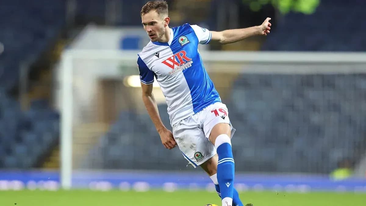 Player kicking ball during a football match
