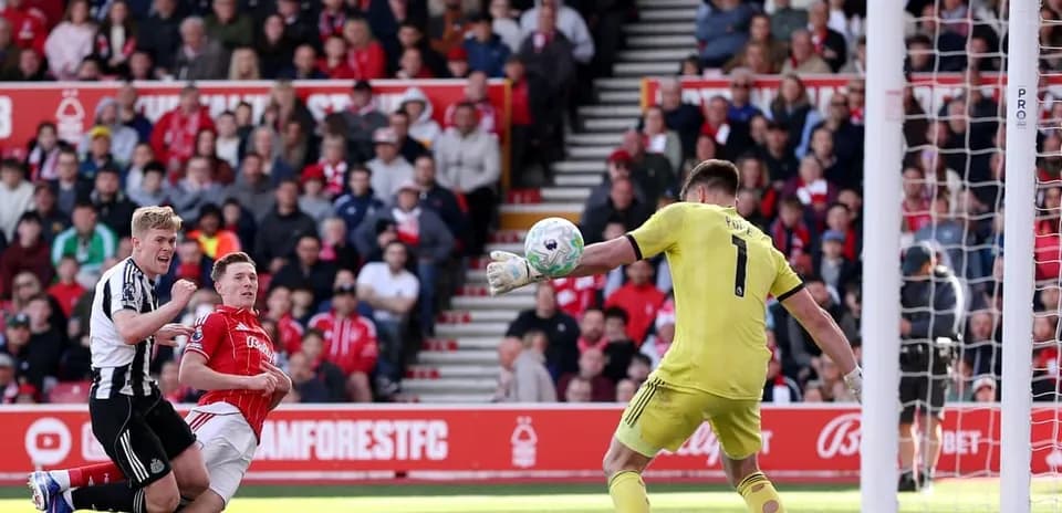 Goalkeeper making a save during Nottingham Forest match