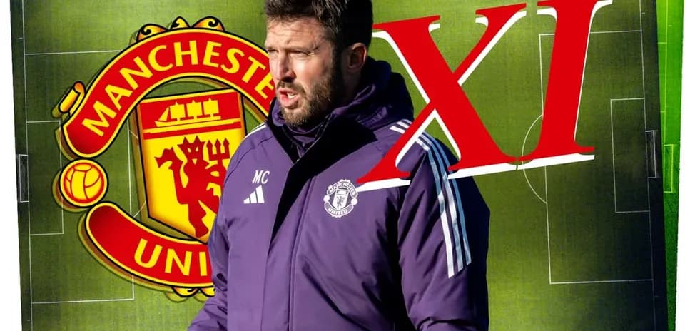 Coach discussing tactics in front of Manchester United logo