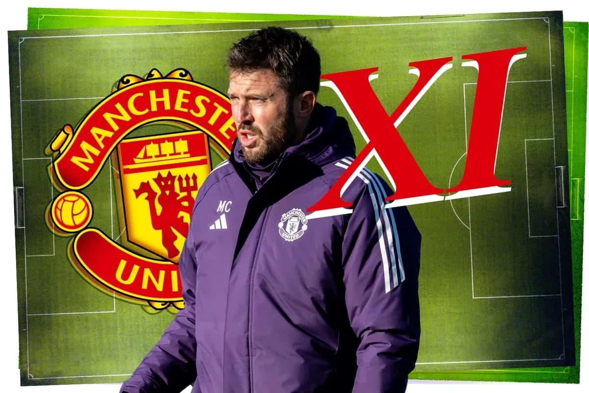 Coach discussing tactics in front of Manchester United logo