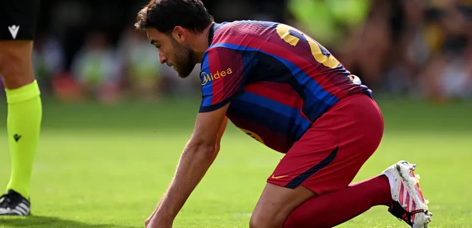 Player kneeling on the pitch during a match