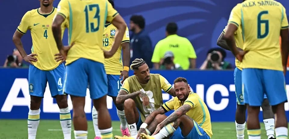 Brazil players react as Neymar sits on field