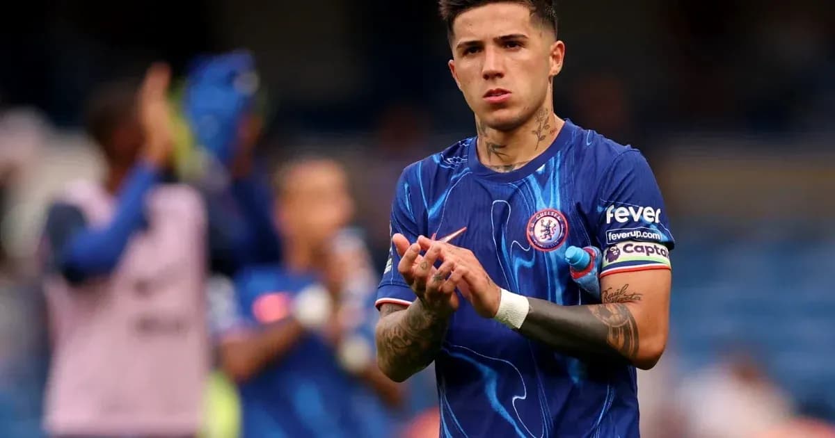 Player applauding fans while wearing Chelsea kit