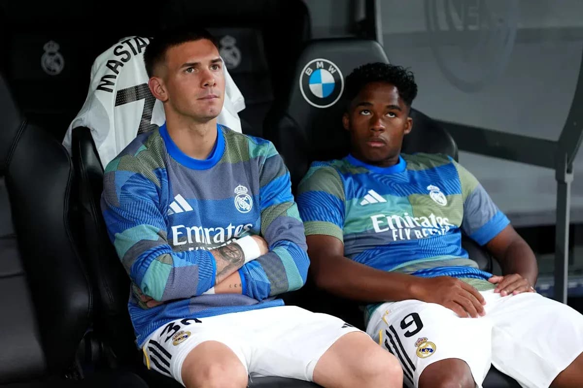 Two Real Madrid players sitting on the bench