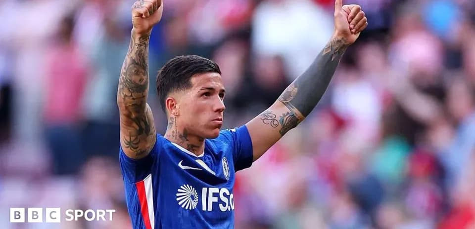 Player celebrating with thumbs up gesture on field