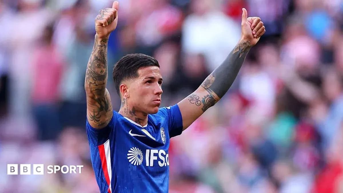 Player celebrating with thumbs up gesture on field