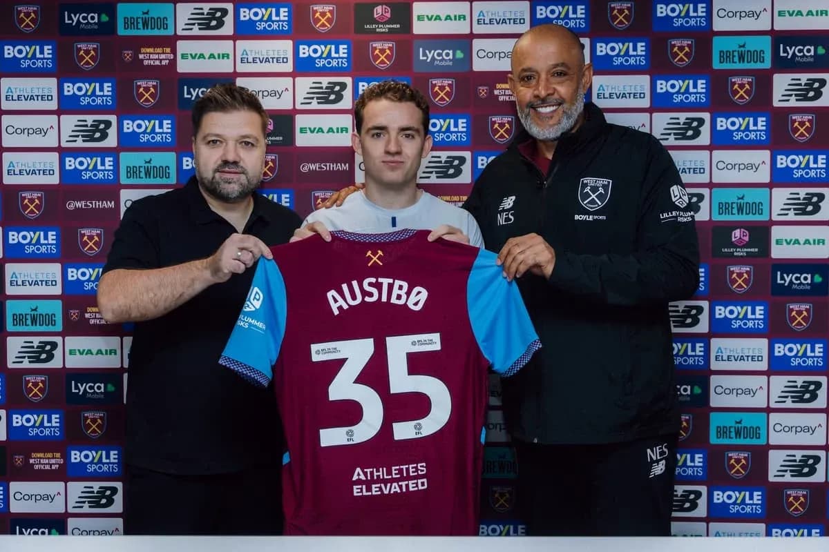 Player holding jersey during club signing announcement
