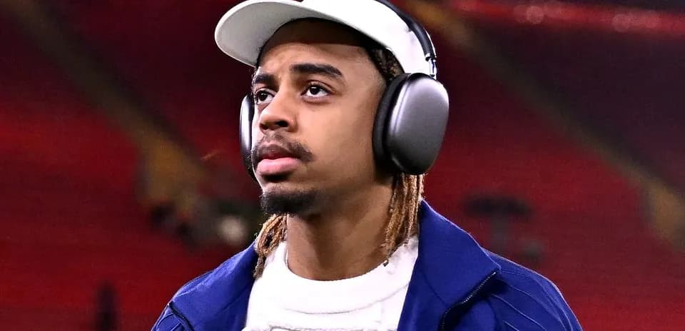 Player wearing headphones before match at stadium