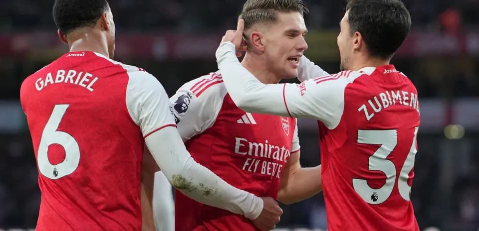 Arsenal players celebrating a goal during match