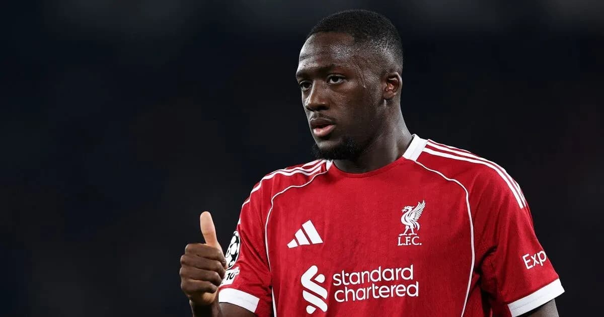Player in red Liverpool kit giving thumbs up