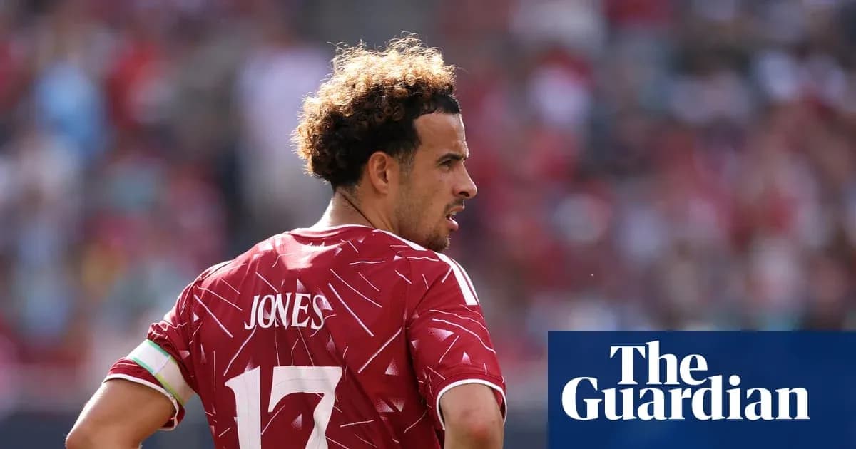 Player in red jersey with 'JONES' on back