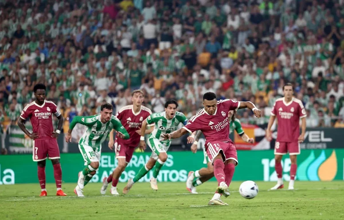 Player taking a penalty kick during match