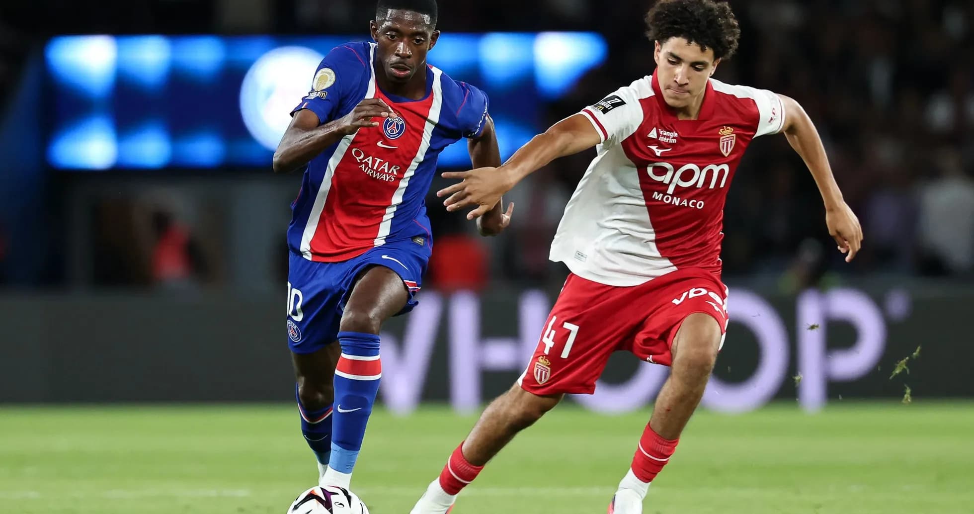 Two players competing for the ball during match
