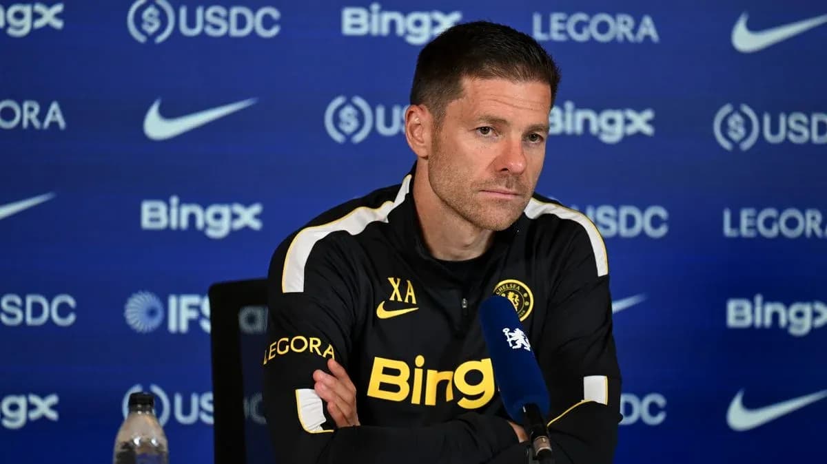 Manager speaking at press conference with microphone