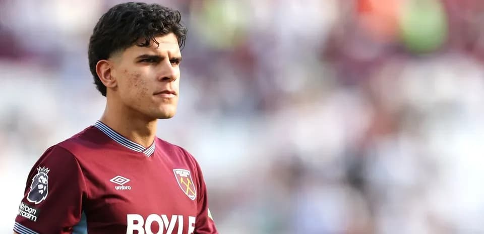 Player wearing West Ham United jersey on pitch
