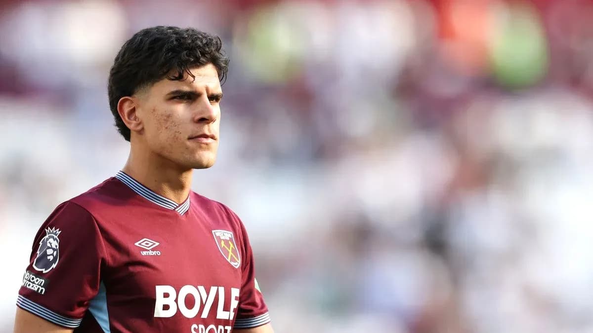 Player wearing West Ham United jersey on pitch
