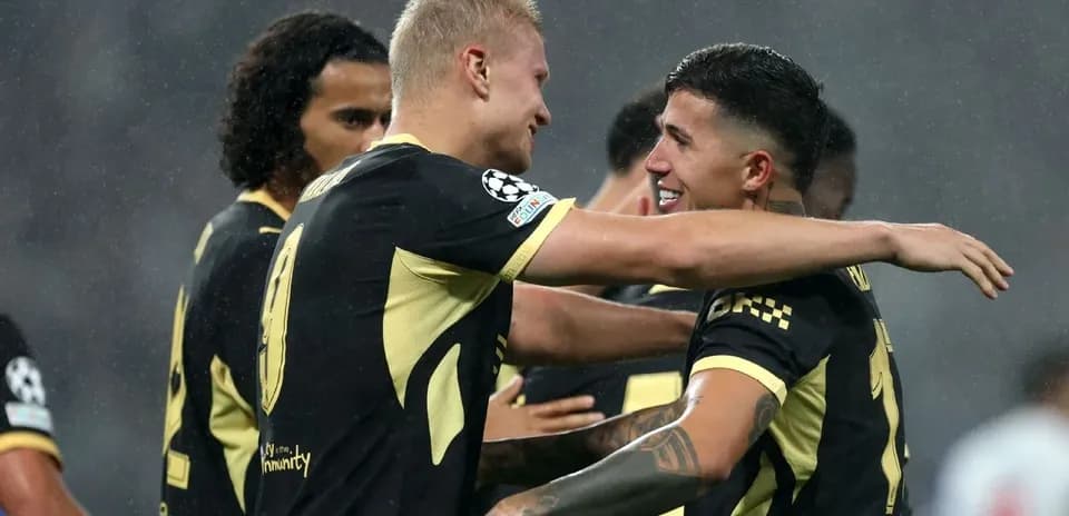 Players celebrating after scoring a goal during match