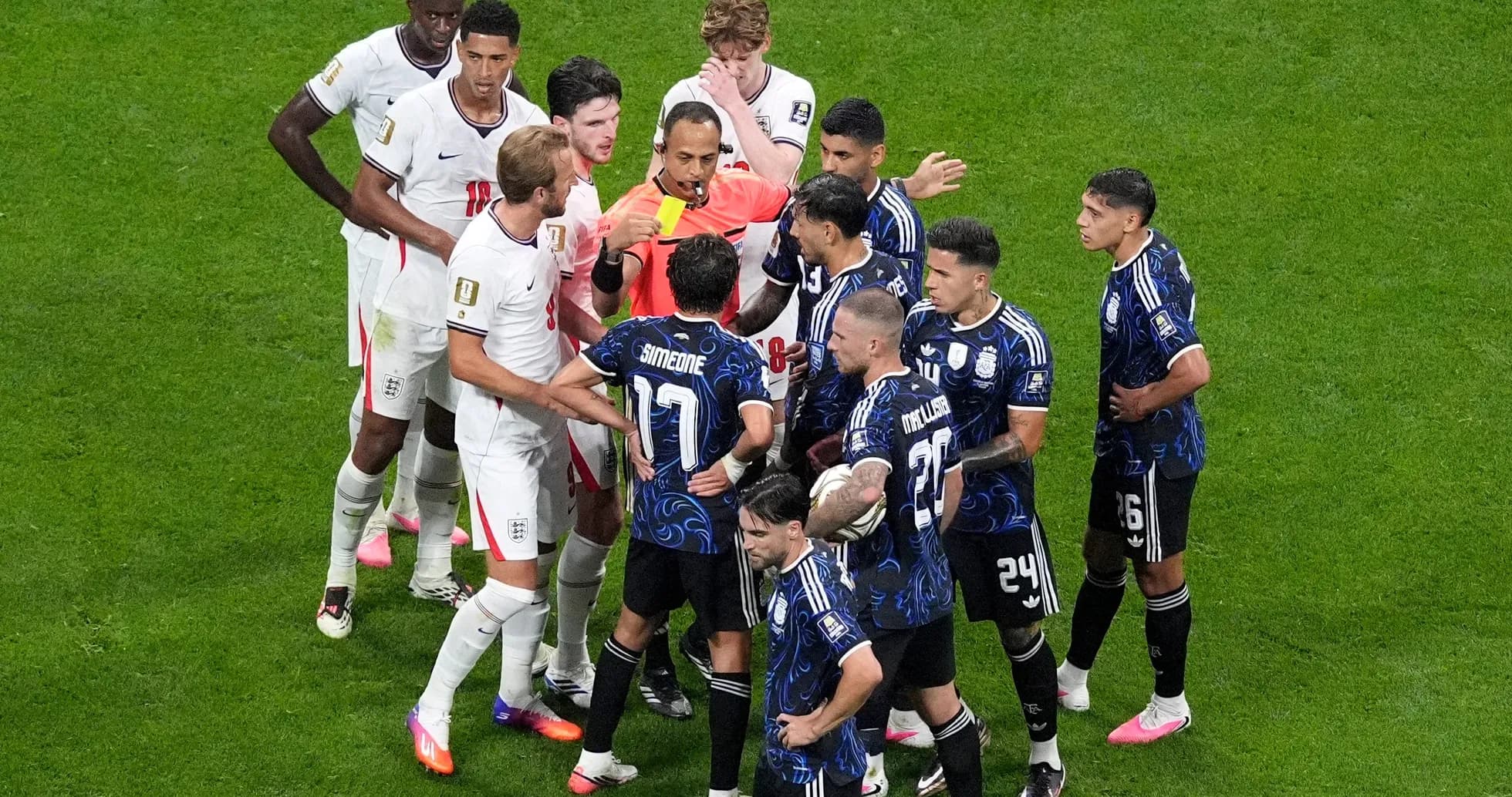 Players from England and Argentina arguing with referee