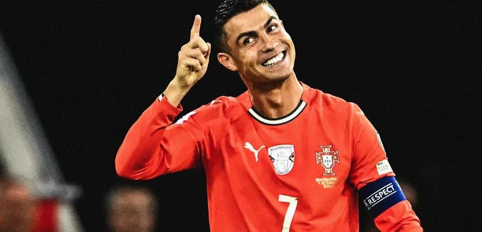 Player celebrating in Portugal's red jersey with raised finger