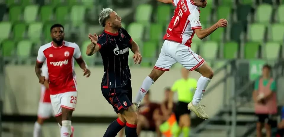 Players contesting for the ball during match