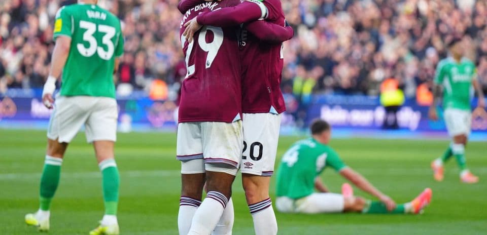 Players celebrating after a goal in match