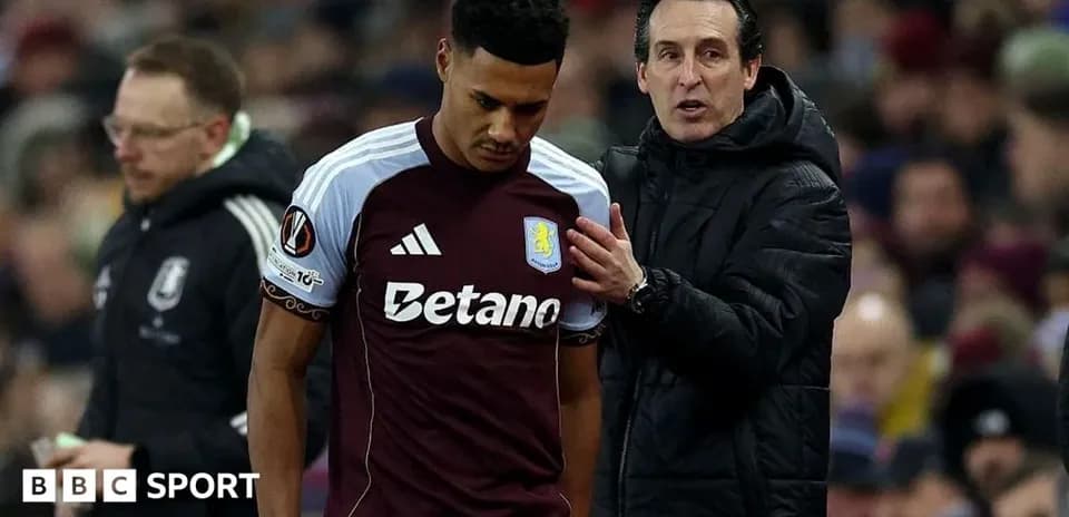 Aston Villa player talking to manager during match