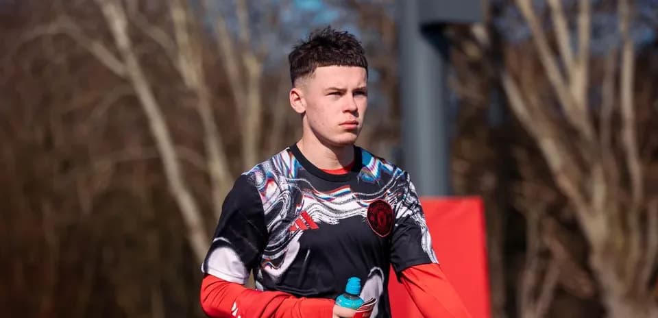 Player walking during training session holding a drink