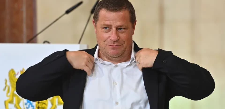 Person adjusting jacket during press event