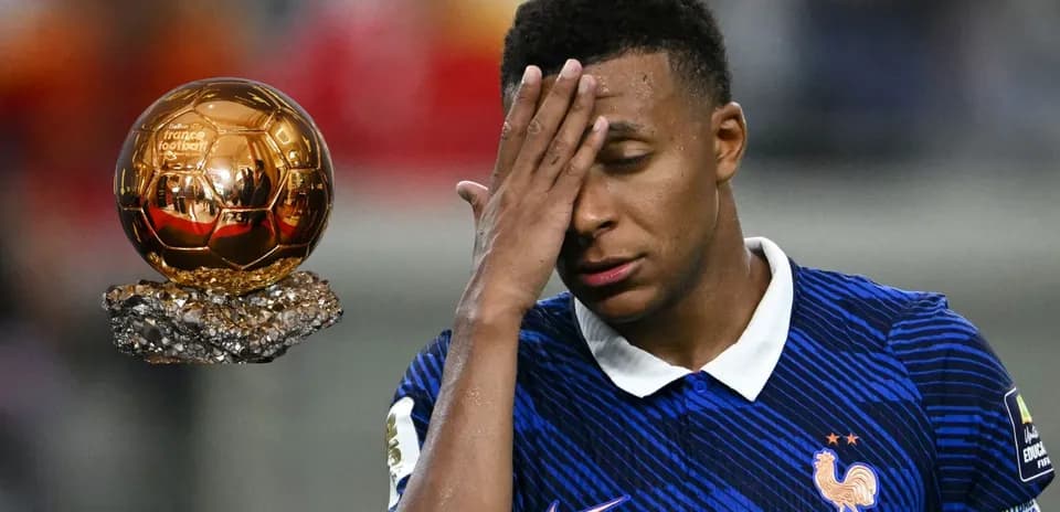 Player reacting near Ballon d'Or trophy